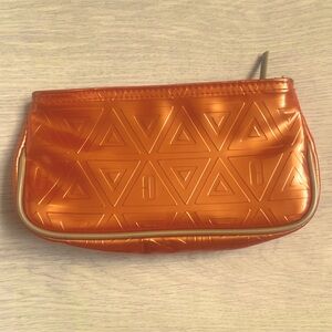 Clinique shiny orange small cosmetics make up case makeup brushes travel pouch